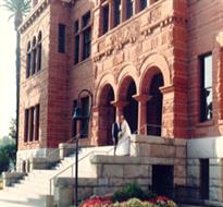 Newly married couple in front of the Old County Courthouse.
