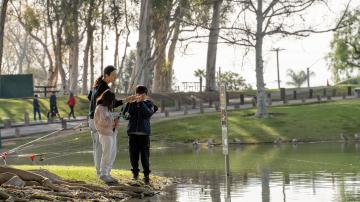 Family fishing at fishing derby.