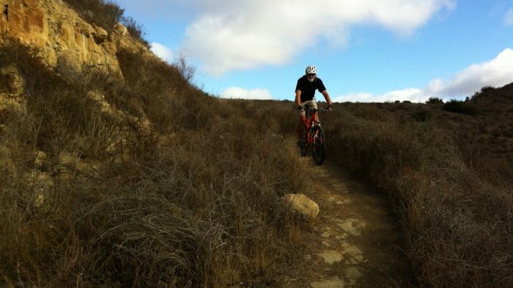 Biker riding downhill.